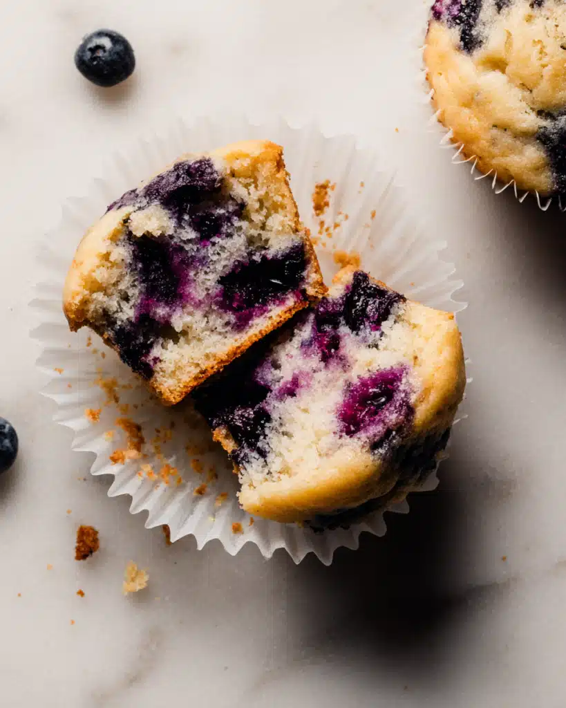 Greek Yogurt Blueberry Protein Muffins 2 Sliced Greek yogurt blueberry protein muffin showing moist crumb