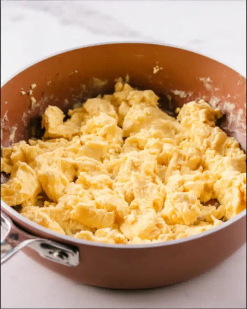 Breakfast Grilled Cheese (Easy, Cheesy & Satisfying Morning Sandwich) 4 Fluffy scrambled eggs cooking in copper skillet