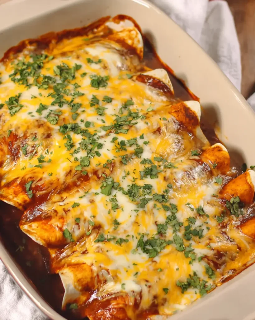 The Best Ground Beef Enchiladas Recipe Everyone Will Love 7 Baked ground beef enchiladas topped with melted cheese and fresh cilantro